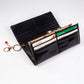 Cartera de privacidad con clave secreta de acceso para mujer. Color: negro y rojo