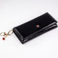 Cartera de privacidad con clave secreta de acceso para mujer. Color: negro y rojo