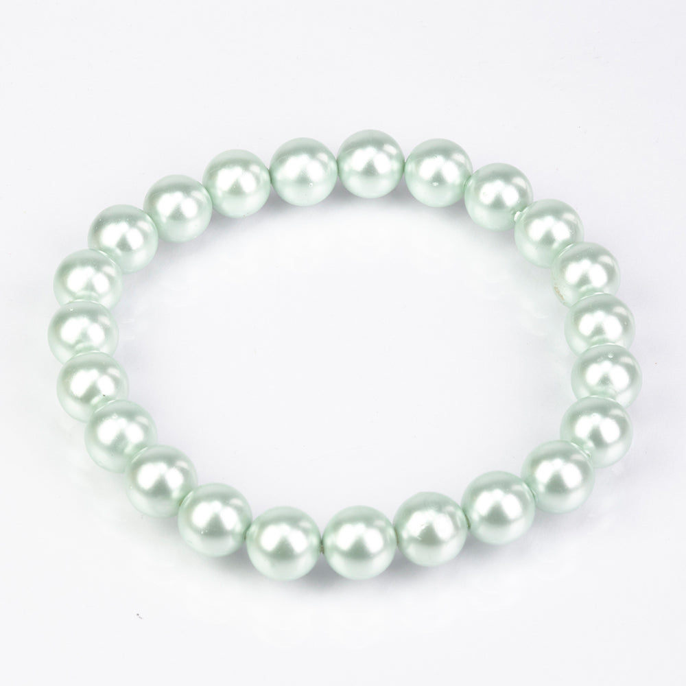 Conjunto de Plata Bañada en Oro con Perla de concha ( Pendientes +Pulsera )