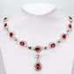 Conjunto de Aleación Bañado en Oro Blanco con Cristal Emporia® Rojo y Cristal Emporia® Blanco ( Collar +Pendientes )